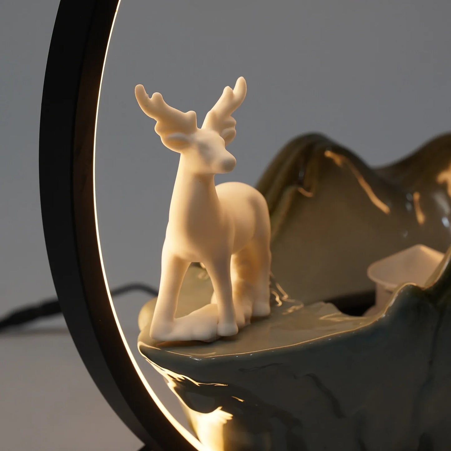 Ceramic Tabletop Fountain With LED Mist Deer Figurine And Pine Branches